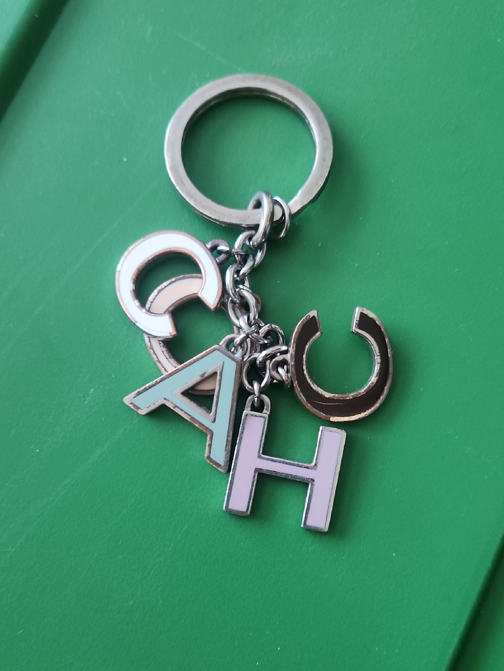 Coach silver-tone letter charm keyring with pastel enamel letters